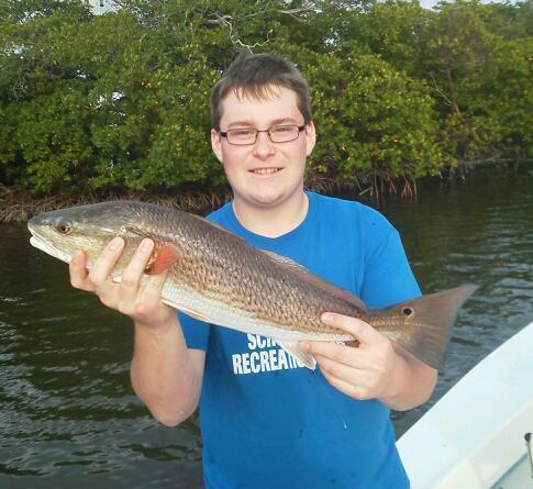 Young angler Rich with one of several beautiful redfish he released on an afternoon half day trip. 1/21/2013
