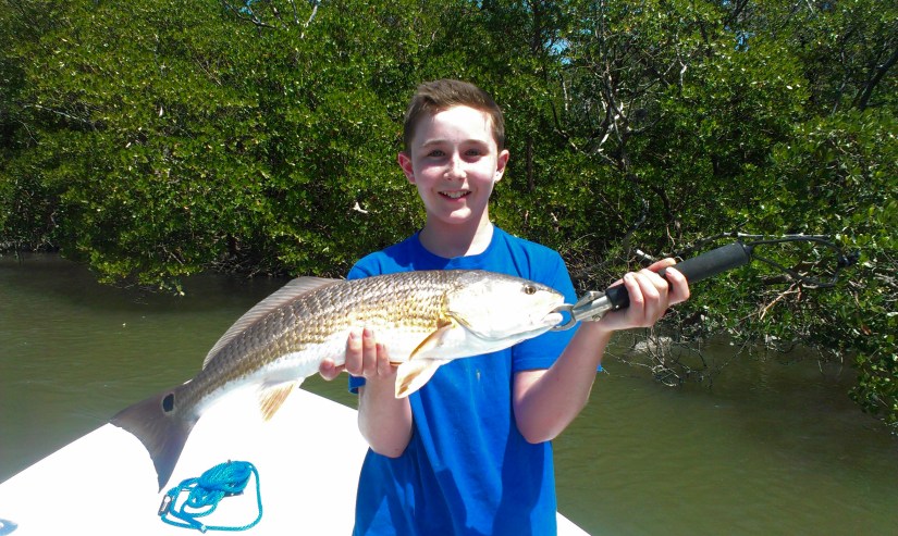Lee James with a gorgeous back country redfish with Capt. Ben Geroy