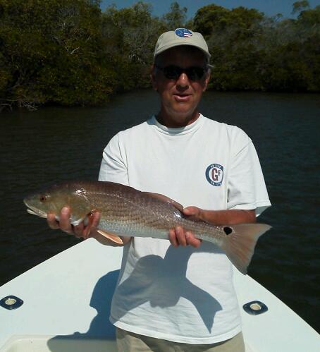 Bill Porter with one of many redfish caught on a recent trip. 04/04/13