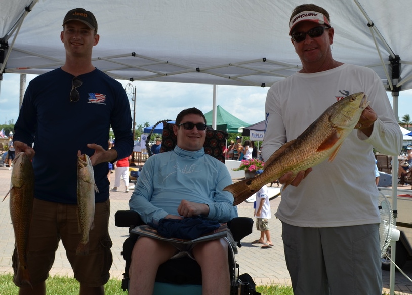 Capt. Todd Geroy and Navy soldier Eric Miller at the Naples Take a Soldier Fishing weigh in. 
