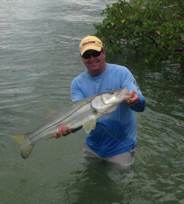 Capt. Todd returns to the boat after retrieving a 15 lb. snook from deep in the mangrove cover. 