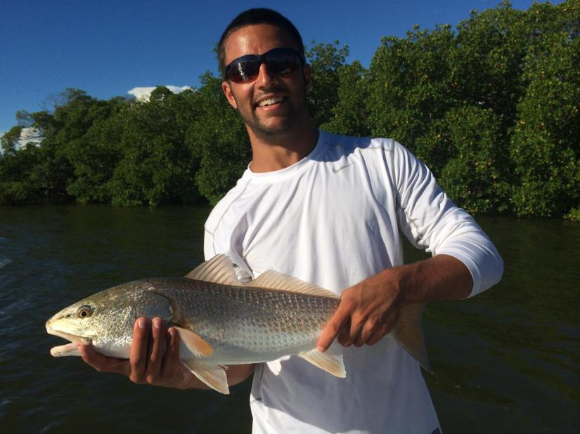 Cody cast way into a tiny mangrove pocket at high tide to produce this nice redfish. 