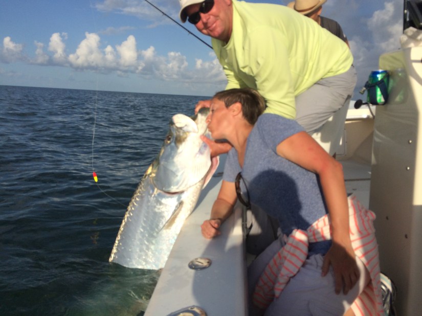Kristy Pennino give a kiss to her giant tarpon released on 8/12/2014