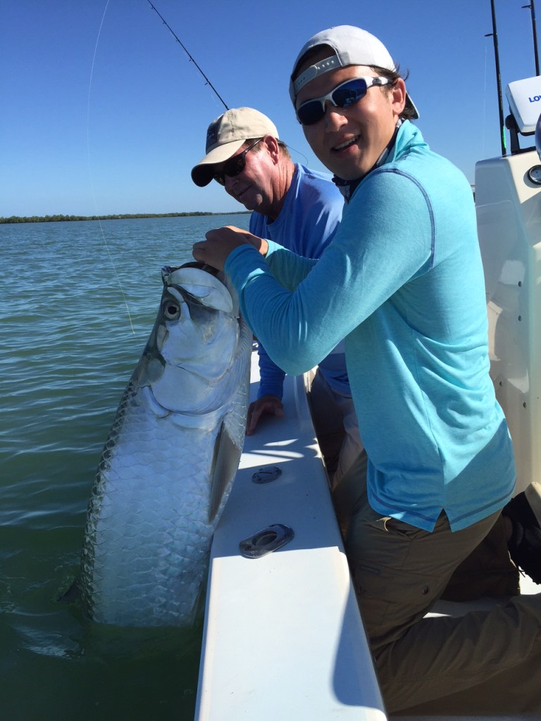Connor about to release his first tarpon ever with Capt. Todd. 6/17/15